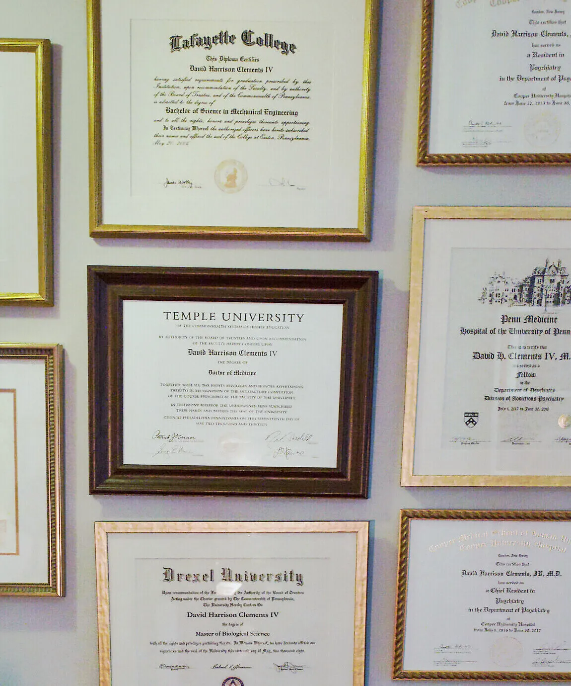 A wall of Dr. Clements's framed credentials at the Chadds Ford office: American Board of Psychiatry and Neurology certifications, a Temple University Doctor of Medicine, and degrees from Lafayette College and Drexel University