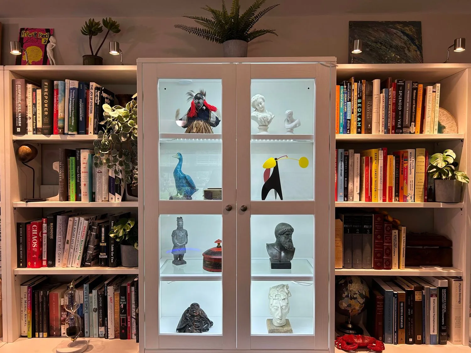 A detail of the Chadds Ford office interior, with warm wood cabinetry and curated objects